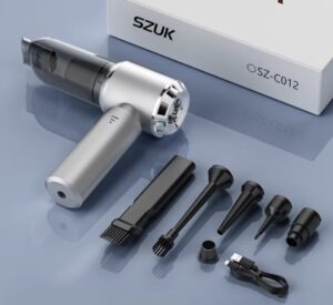 SZUK SZ-C012 handheld vacuum cleaner with multiple nozzle attachments, including brushes and crevice tools, on a glossy surface